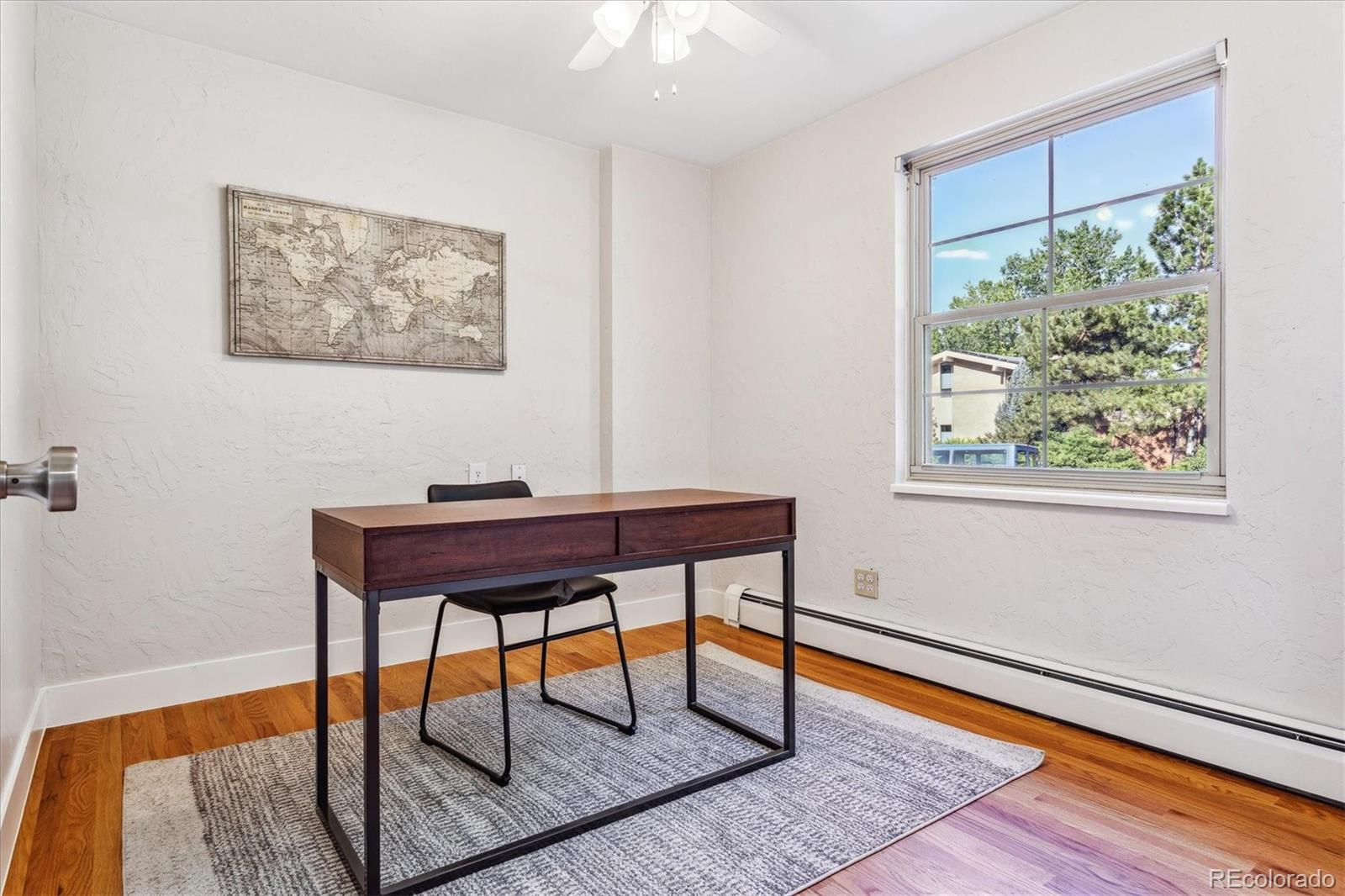 1975 South Locust Street Denver, CO 80224 - Photo 21 of 40 a view of a workspace with furniture and a window