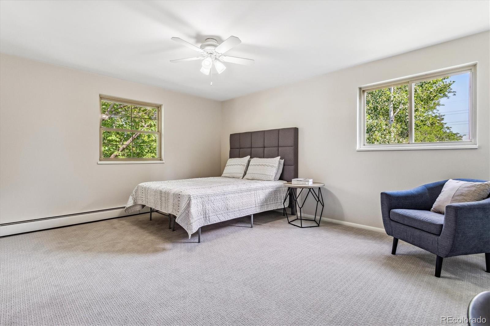 1975 South Locust Street Denver, CO 80224 - Photo 23 of 40 a bedroom with a bed and a couch