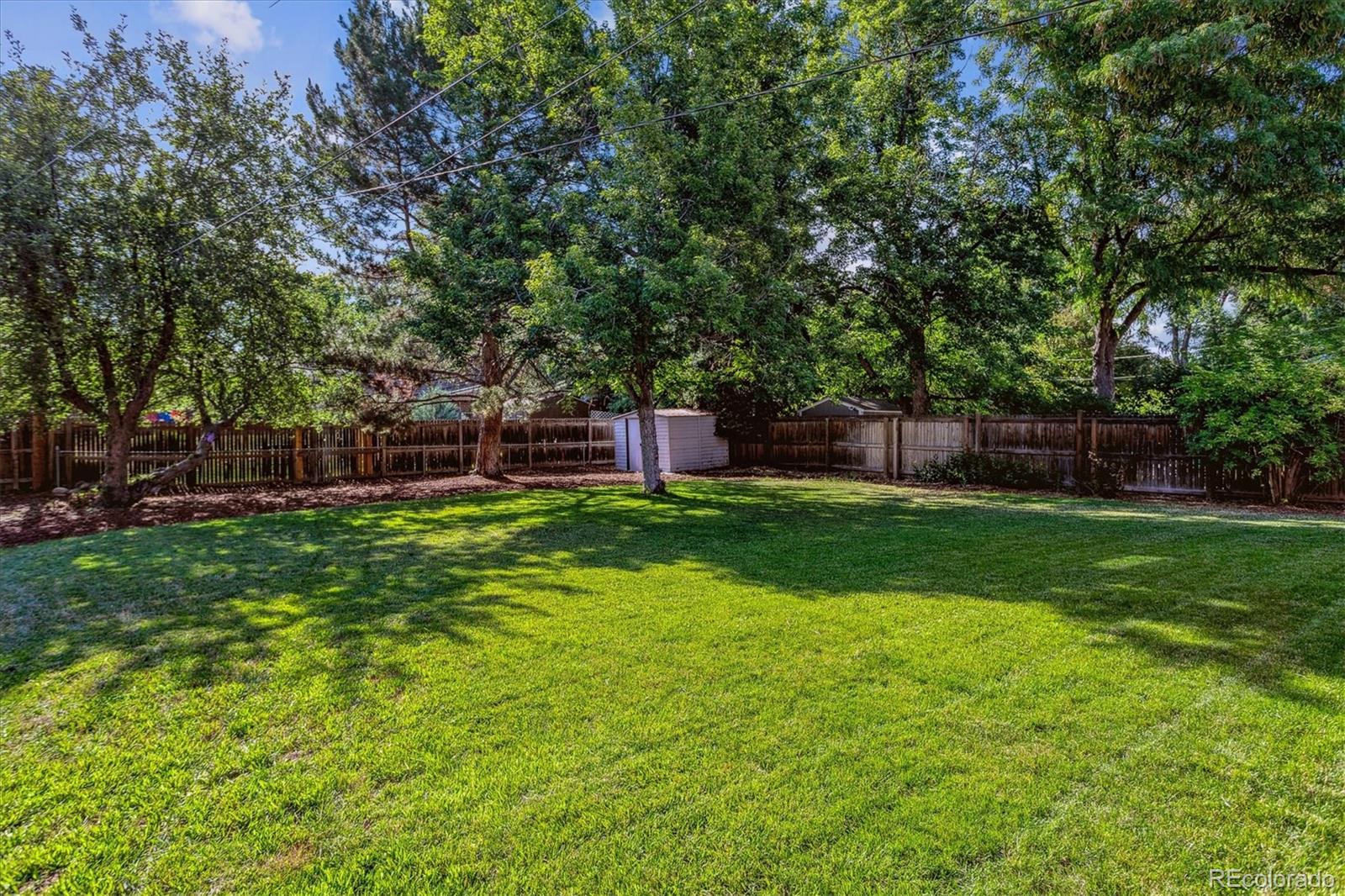 1975 South Locust Street Denver, CO 80224 - Photo 35 of 40 a view of house with backyard space