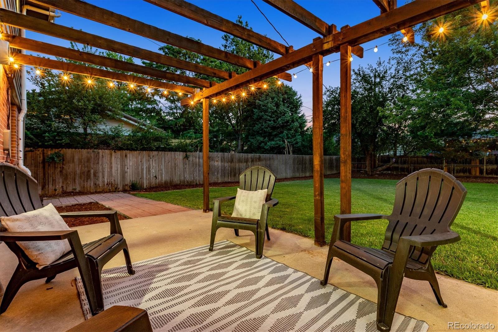 1975 South Locust Street Denver, CO 80224 - Photo 36 of 40 a swimming pool with outdoor seating and yard