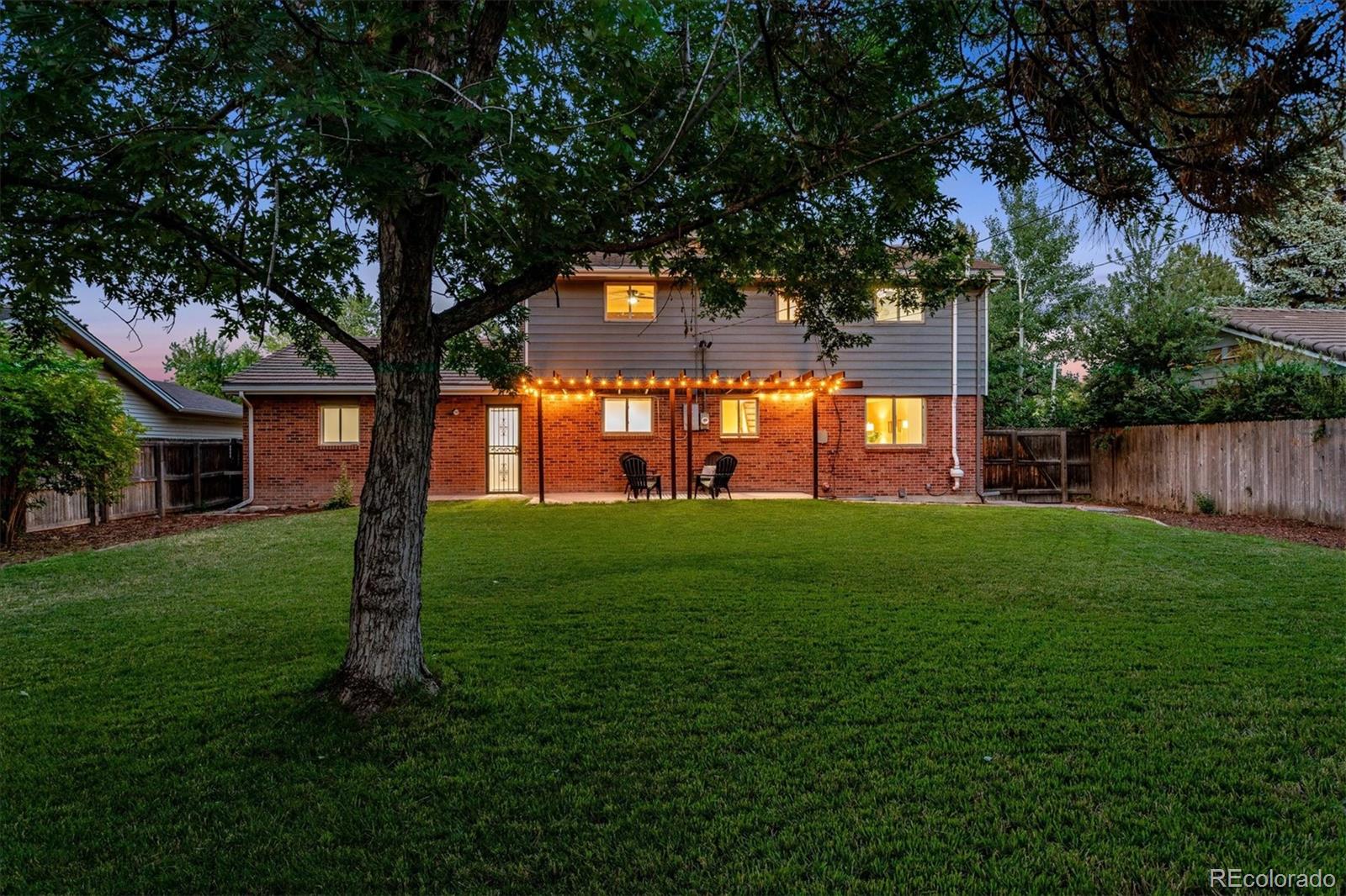 1975 South Locust Street Denver, CO 80224 - Photo 38 of 40 a view of a house with a backyard