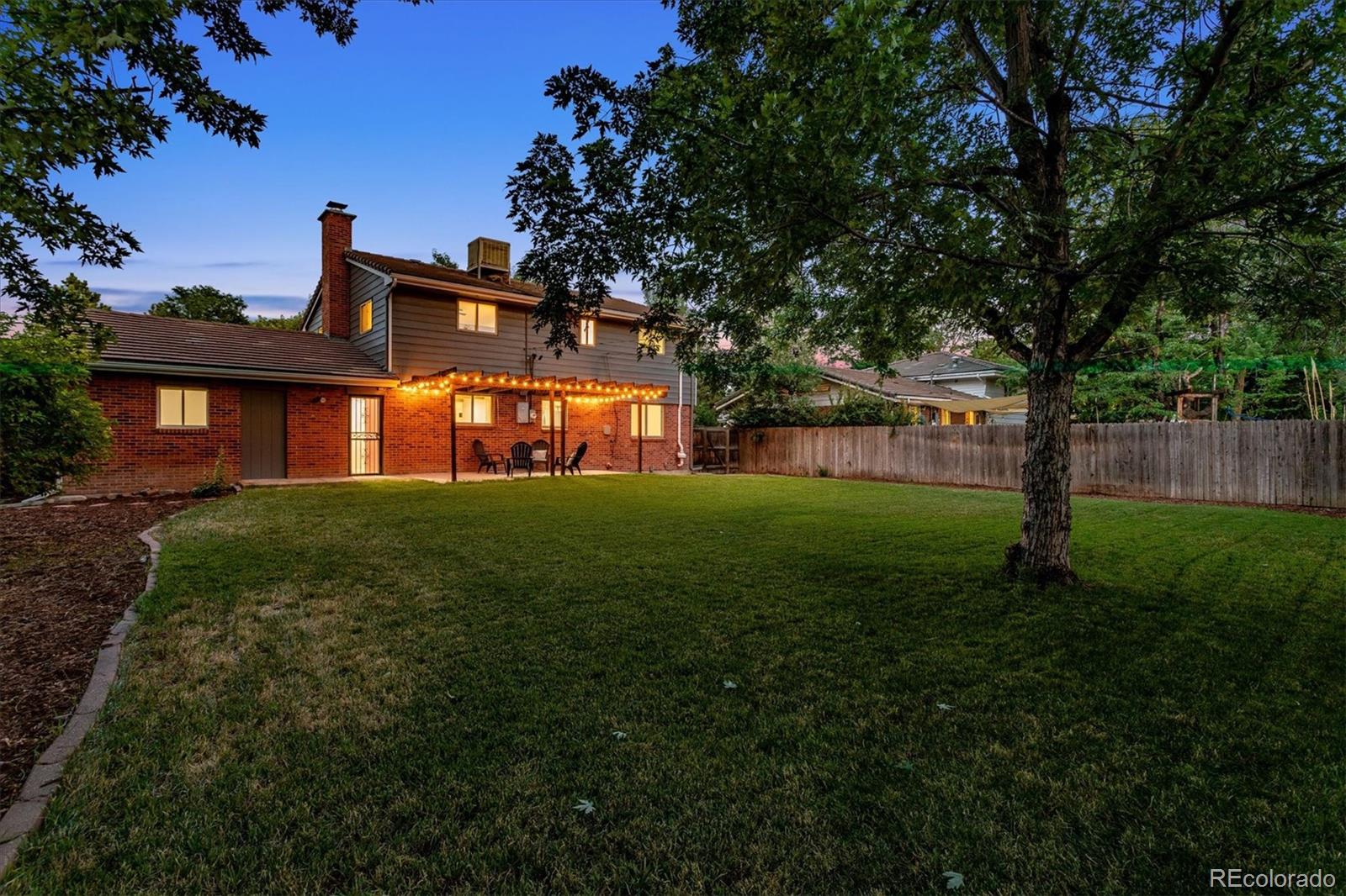 1975 South Locust Street Denver, CO 80224 - Photo 39 of 40 a front view of a house with garden