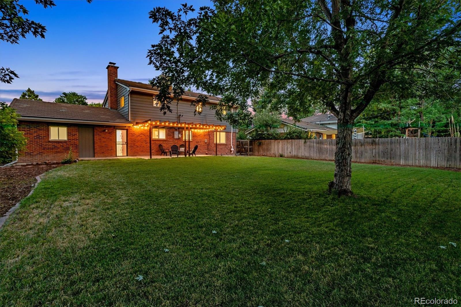 1975 South Locust Street Denver, CO 80224 - Photo 40 of 40 a view of a house with backyard and garden