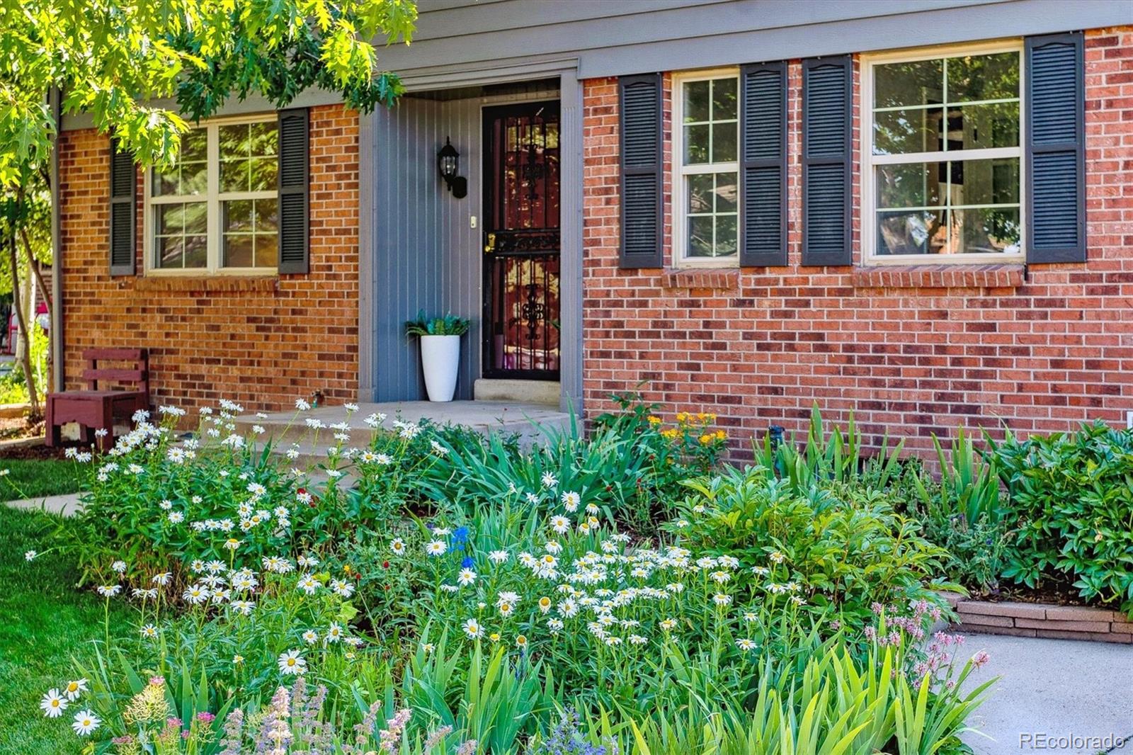1975 South Locust Street Denver, CO 80224 - Photo 5 of 40 front view of a brick house with a large windows