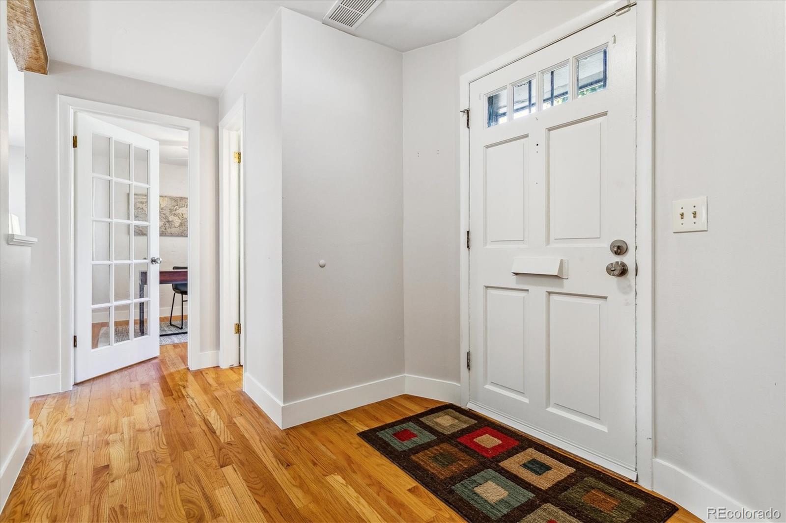 1975 South Locust Street Denver, CO 80224 - Photo 7 of 40 a view of room with window and wooden floor