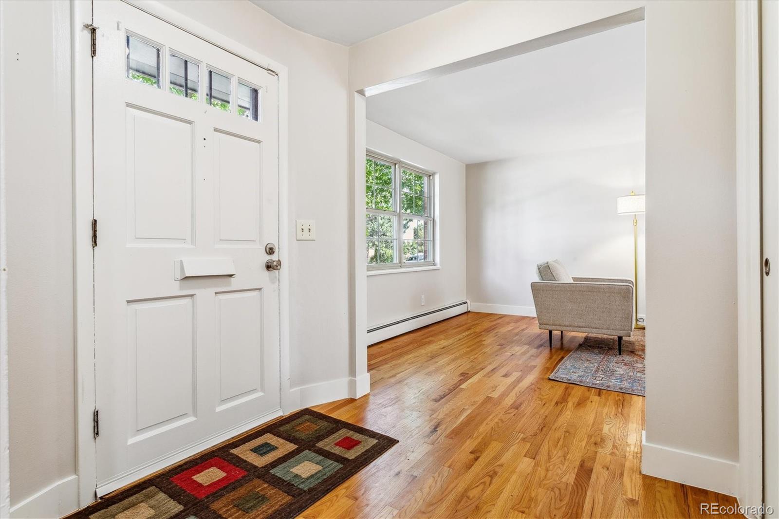 1975 South Locust Street Denver, CO 80224 - Photo 8 of 40 a view of room with window and wooden floor