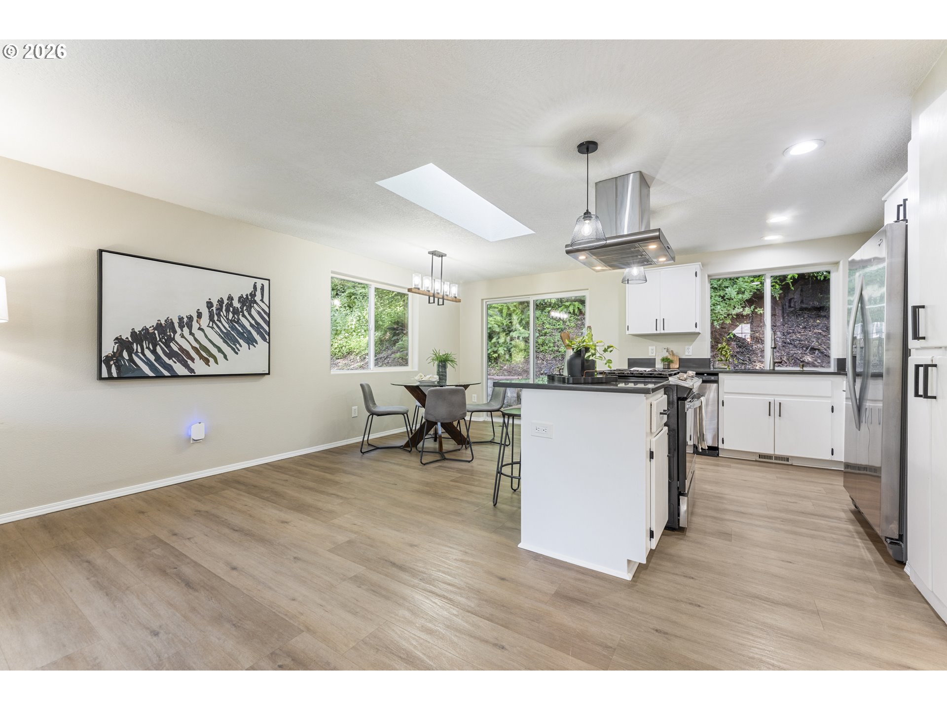4024 Southeast 154th Place Portland, OR 97236 - Photo 8 of 43 a kitchen with a refrigerator and a sink