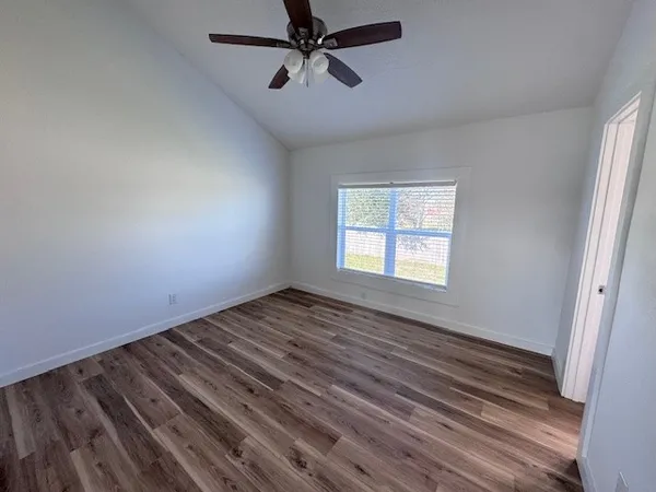 a front view of a house with a yard table and chairs
