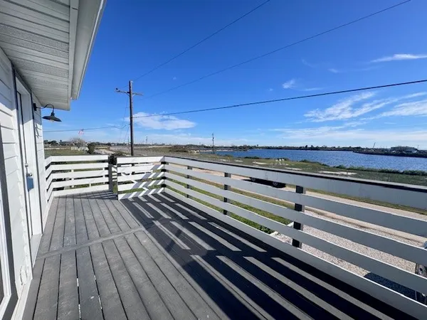 a view of outdoor space with lots of wooden furniture