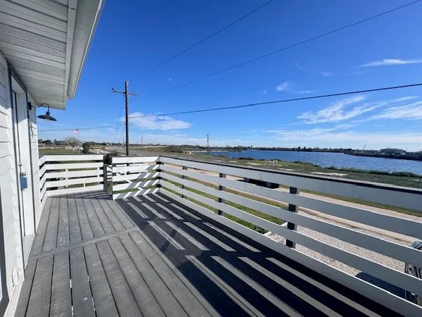 a view of a balcony with wooden floor