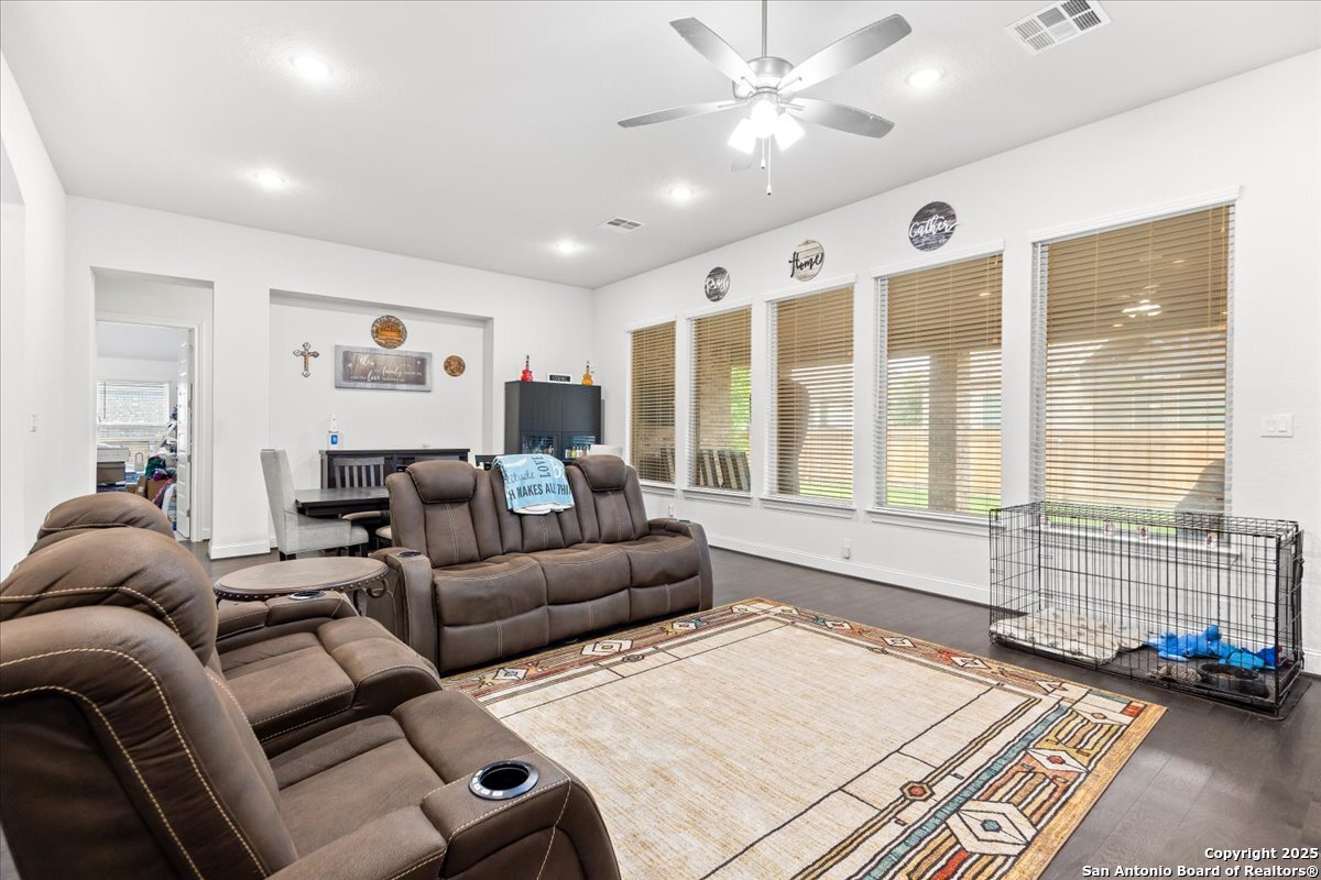 6957 Hallie Loop Schertz, TX 78154 - Photo 15 of 51 a living room with furniture and a large window