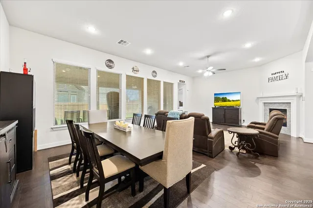 a view of a dining room with furniture window and outside view