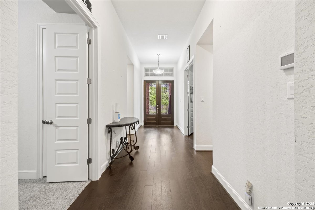 6957 Hallie Loop Schertz, TX 78154 - Photo 20 of 51 wooden floor in an empty room