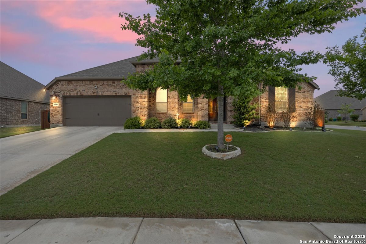 6957 Hallie Loop Schertz, TX 78154 - Photo 2 of 51 a front view of a house with garden