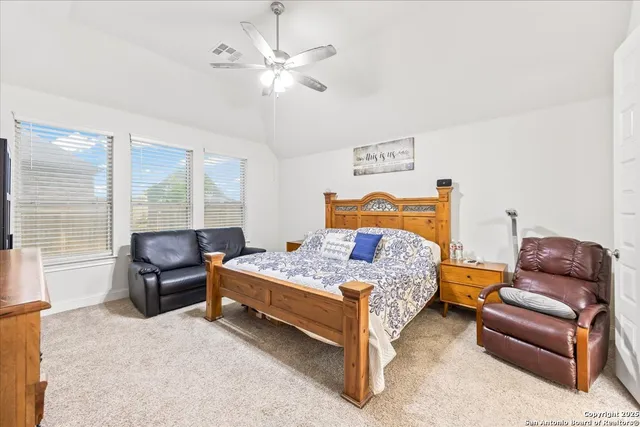 a bedroom with a bed and furniture