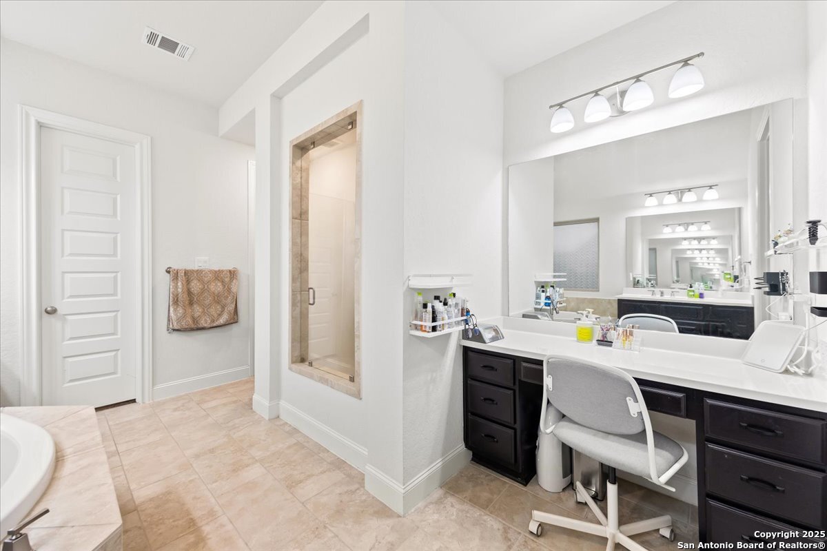 6957 Hallie Loop Schertz, TX 78154 - Photo 26 of 51 a room with a desk and chair