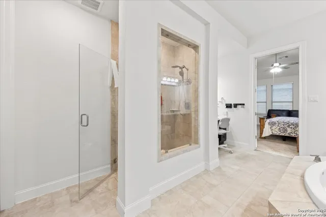 a en suite bathroom with a toilet sink and shower