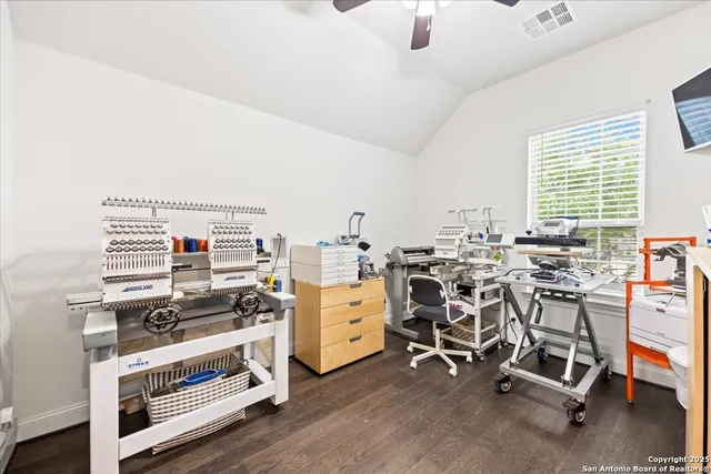 a bathroom with a sink toilet vanity and shower