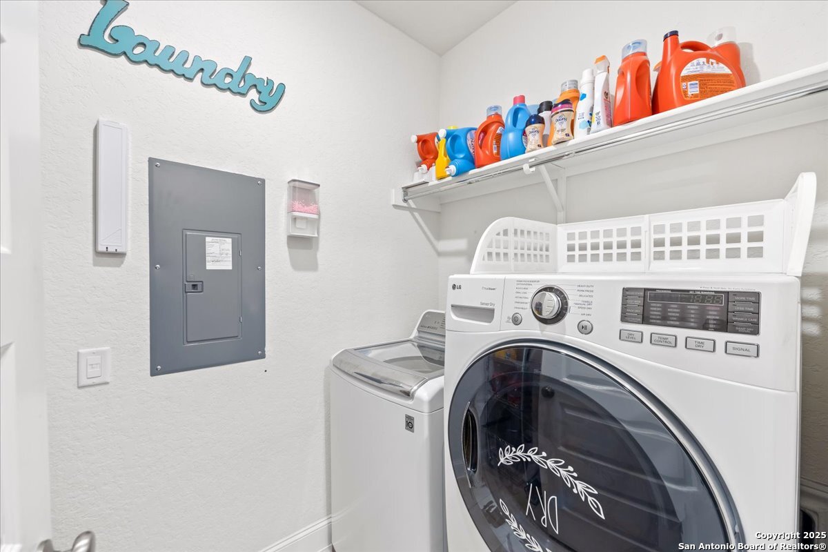 6957 Hallie Loop Schertz, TX 78154 - Photo 35 of 51 a utility room with dryer and washer