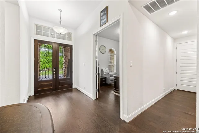 a view of livingroom with furniture and hardwood floor