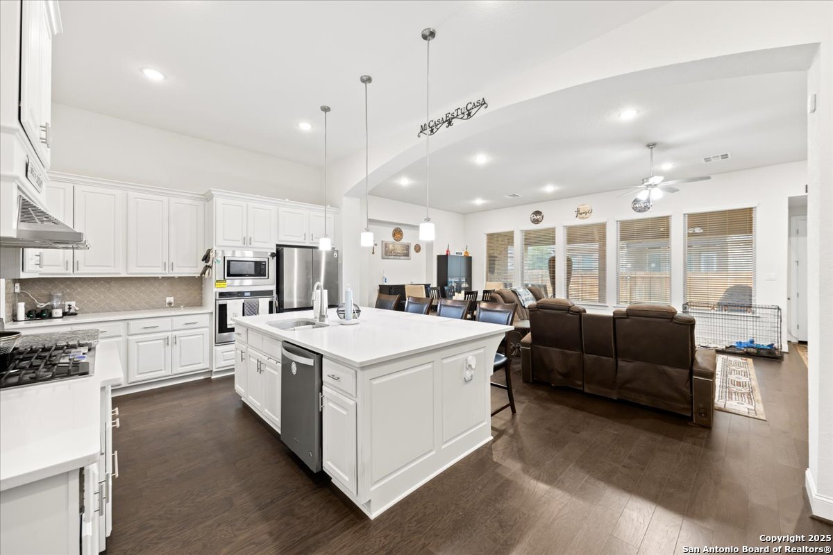6957 Hallie Loop Schertz, TX 78154 - Photo 8 of 51 a large white kitchen with a large window