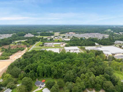 an aerial view of residential building and lake