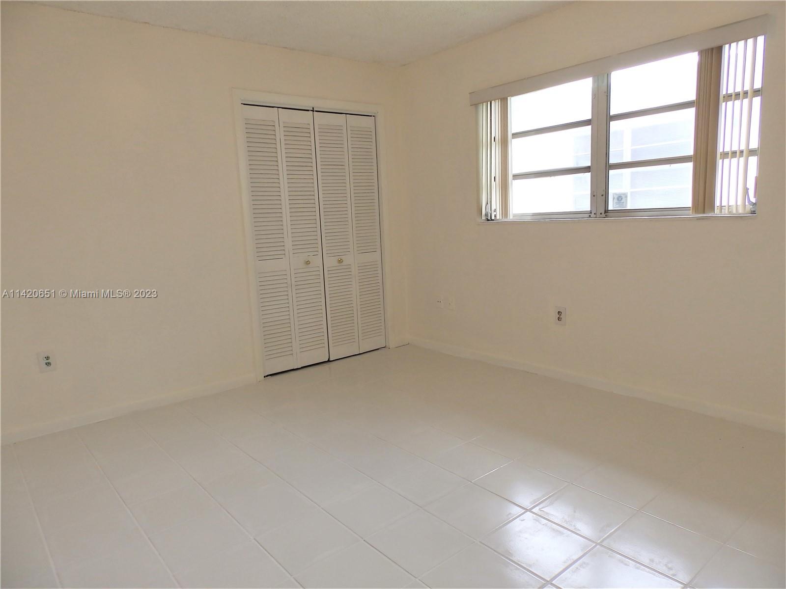 7442 Southwest 22nd Street, Unit 7442 Miami, FL 33155 - Photo 11 of 11 an empty room with a windows