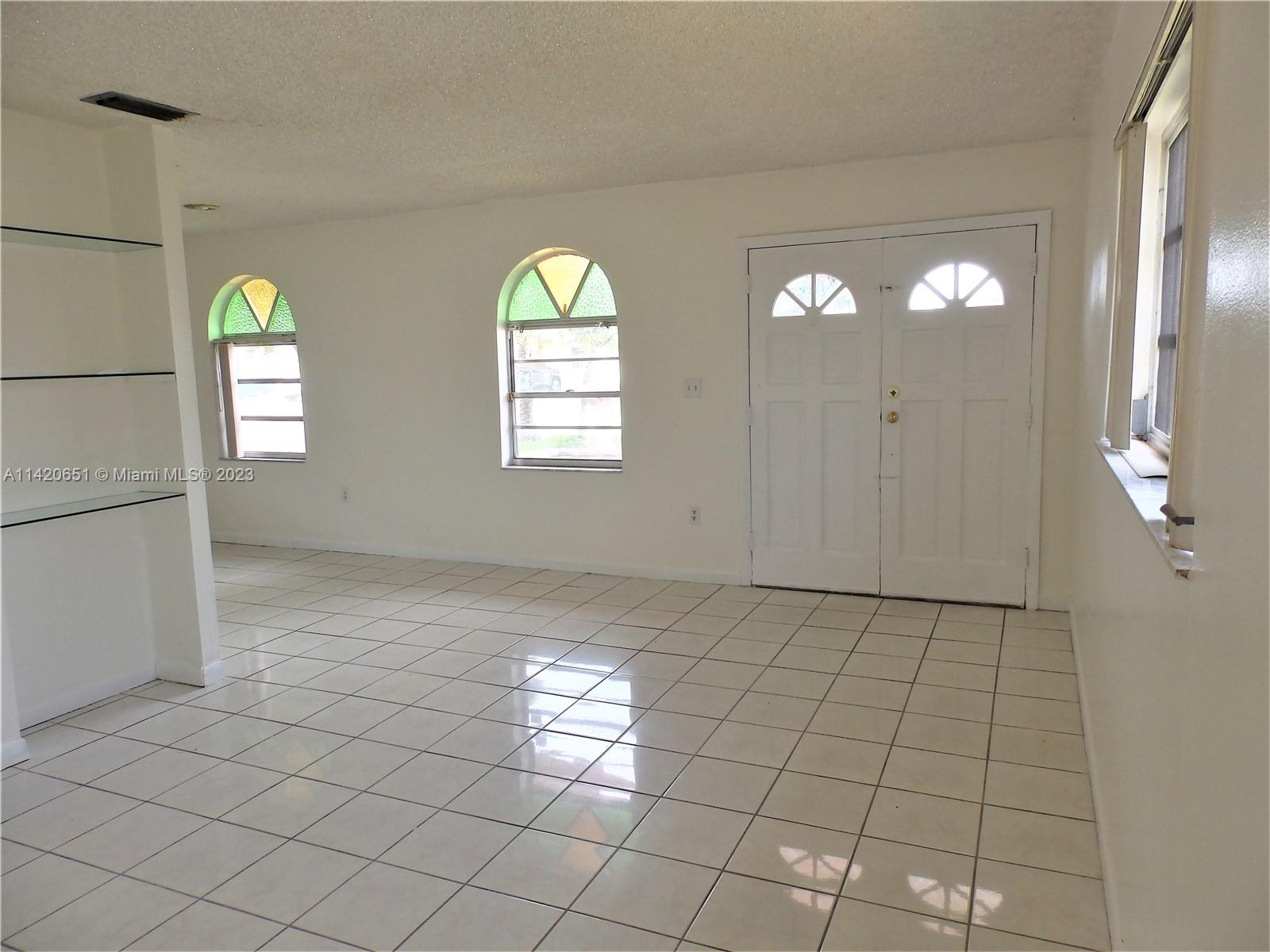 7442 Southwest 22nd Street, Unit 7442 Miami, FL 33155 - Photo 2 of 11 a view of an empty room and window