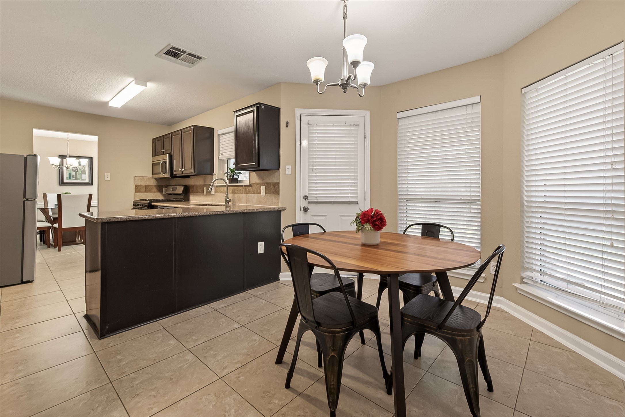618 Bold Ruler Drive Stafford, TX 77477 - Photo 14 of 35 a view of a dining room with furniture and window