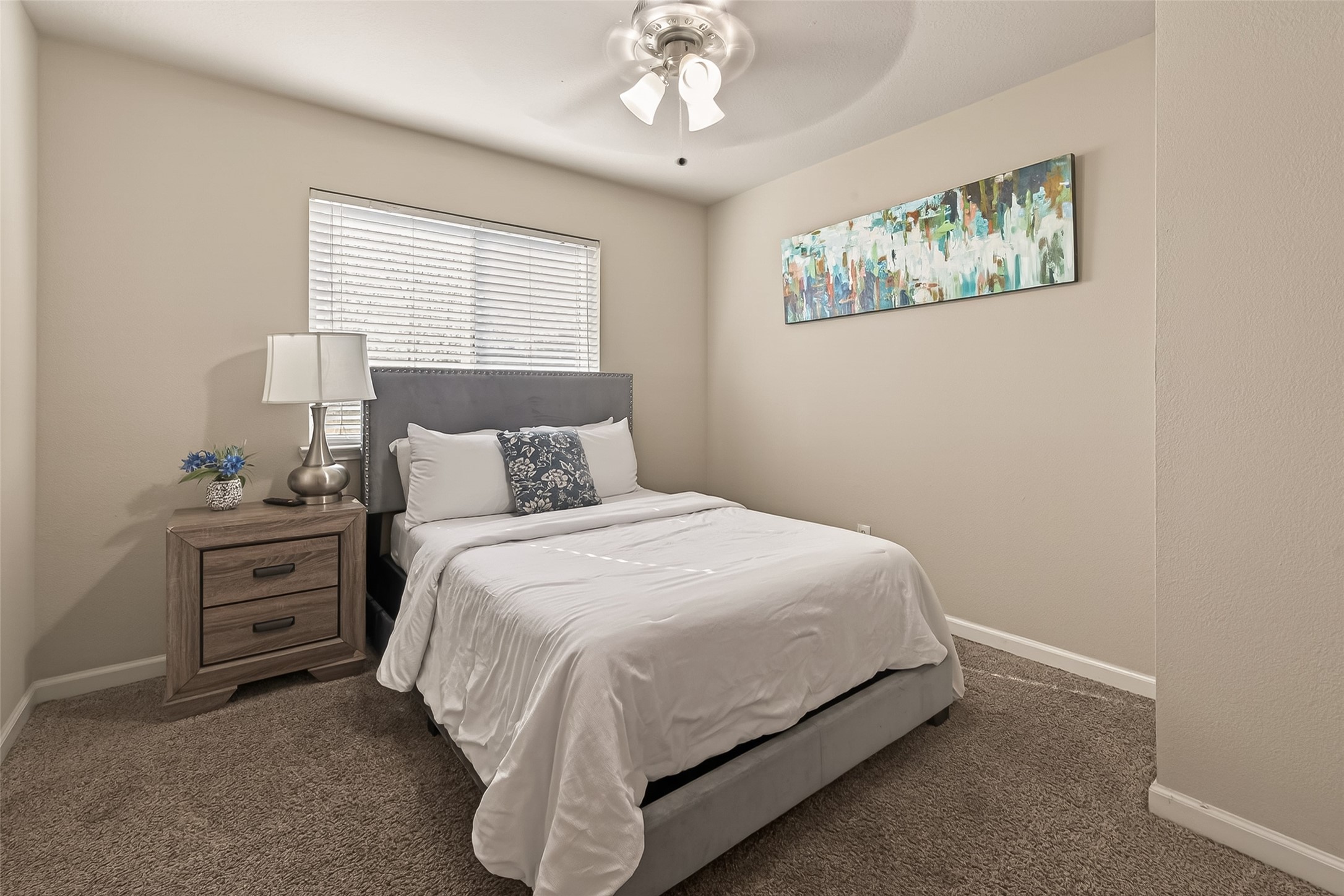 618 Bold Ruler Drive Stafford, TX 77477 - Photo 21 of 35 a bedroom with a bed and a chandelier
