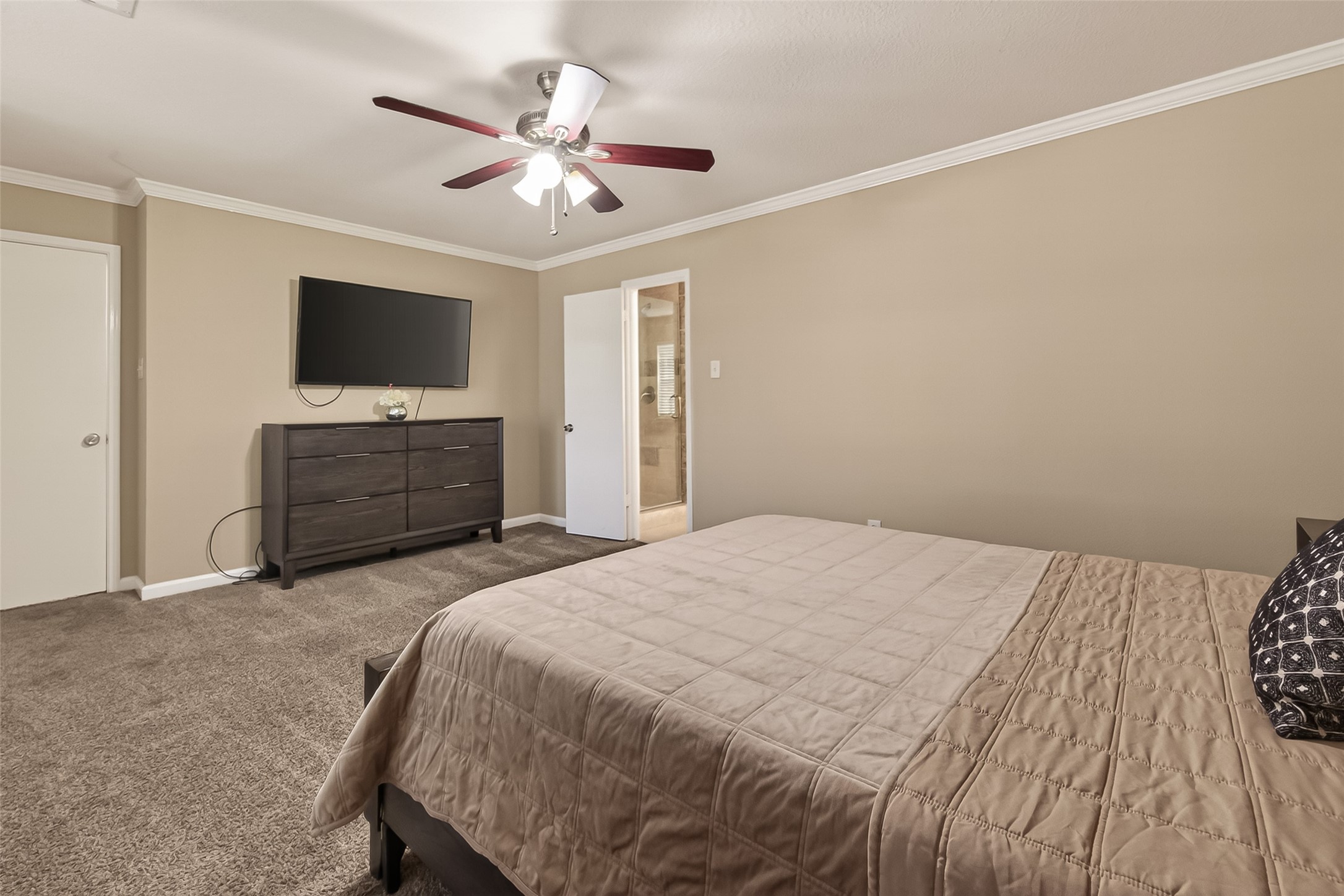 618 Bold Ruler Drive Stafford, TX 77477 - Photo 27 of 35 a bedroom with a bed and a flat screen tv