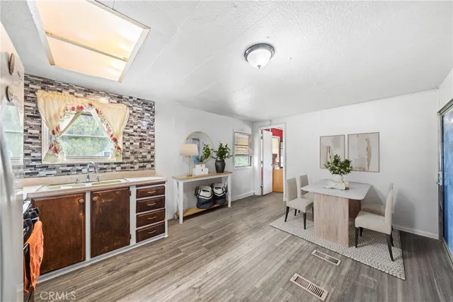 a bedroom with a bed and a potted plant