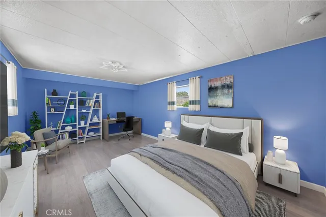 a bedroom with a bed and a couch