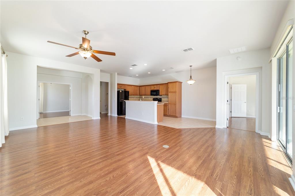 7153 Southwest 93rd Avenue Ocala, FL 34481 - Photo 14 of 61 a view of a kitchen with a dishwasher and wooden floor