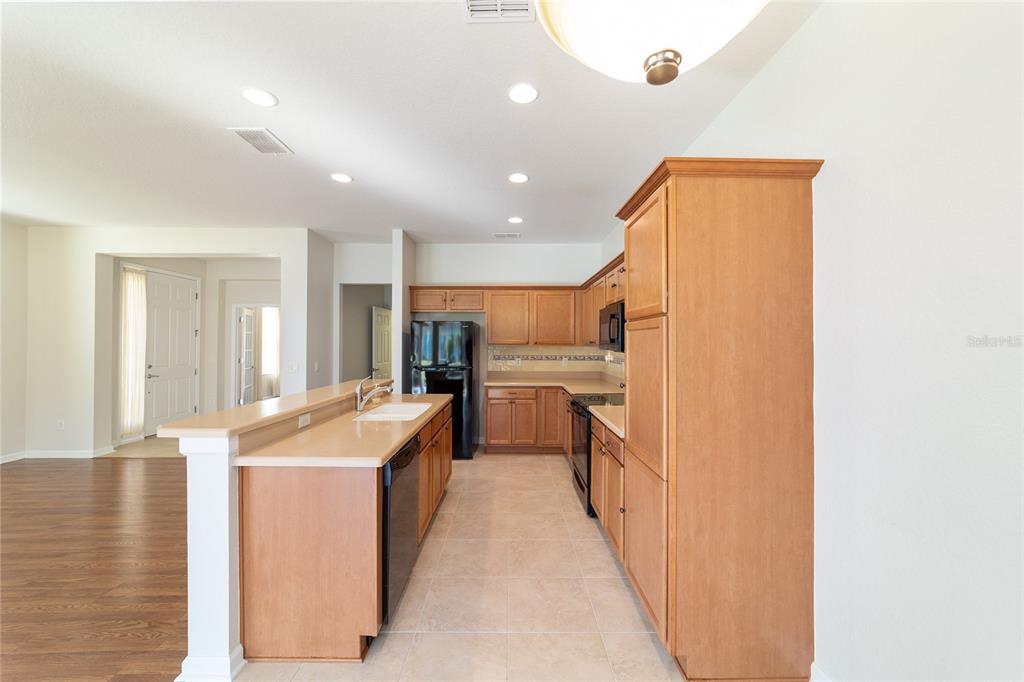 7153 Southwest 93rd Avenue Ocala, FL 34481 - Photo 20 of 61 a kitchen with stainless steel appliances granite countertop a sink and cabinets