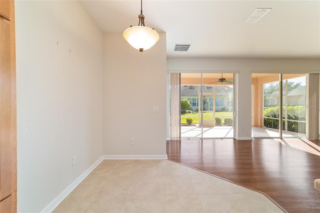 7153 Southwest 93rd Avenue Ocala, FL 34481 - Photo 25 of 61 an empty room with wooden floor and windows