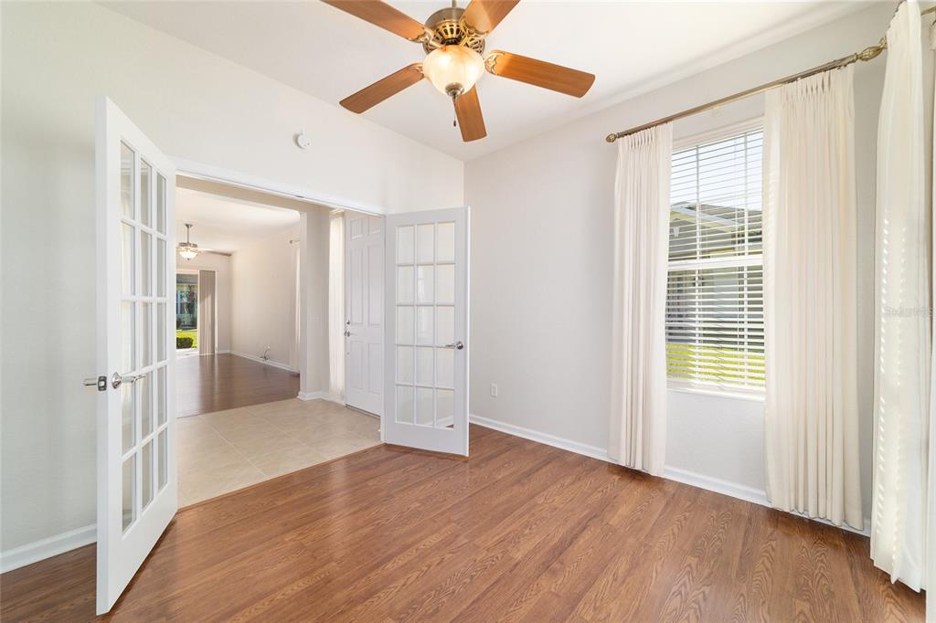 7153 Southwest 93rd Avenue Ocala, FL 34481 - Photo 35 of 61 wooden floor in an empty room with a window