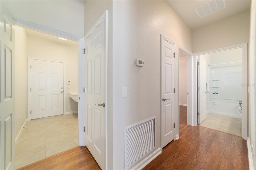 7153 Southwest 93rd Avenue Ocala, FL 34481 - Photo 36 of 61 a view of a hallway with wooden floor