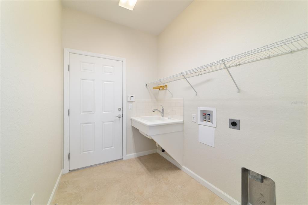 7153 Southwest 93rd Avenue Ocala, FL 34481 - Photo 39 of 61 a bathroom with a sink a mirror and shower
