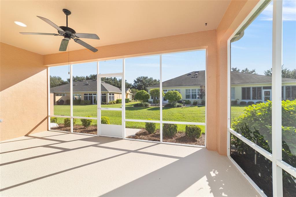 7153 Southwest 93rd Avenue Ocala, FL 34481 - Photo 40 of 61 a view of a balcony with a floor to ceiling window and wooden floor