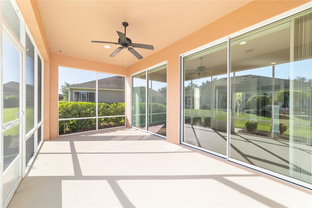 7153 Southwest 93rd Avenue Ocala, FL 34481 - Photo 41 of 61 a room with a large window and a ceiling fan