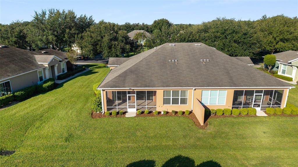 7153 Southwest 93rd Avenue Ocala, FL 34481 - Photo 43 of 61 an aerial view of a house with swimming pool garden and trees