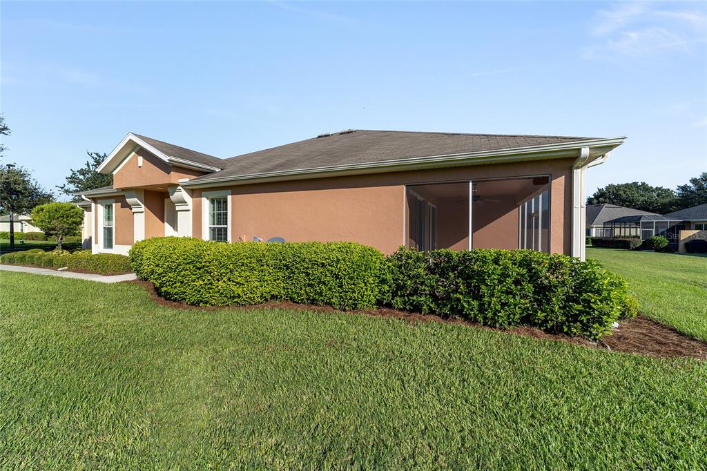 7153 Southwest 93rd Avenue Ocala, FL 34481 - Photo 7 of 61 a front view of a house with a yard