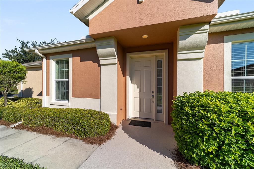 7153 Southwest 93rd Avenue Ocala, FL 34481 - Photo 8 of 61 a front view of a house with garden