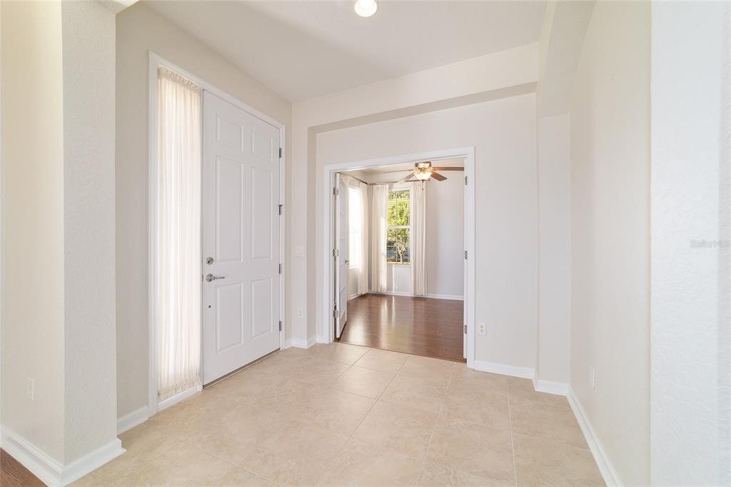 7153 Southwest 93rd Avenue Ocala, FL 34481 - Photo 10 of 61 a view of empty room with wooden floor