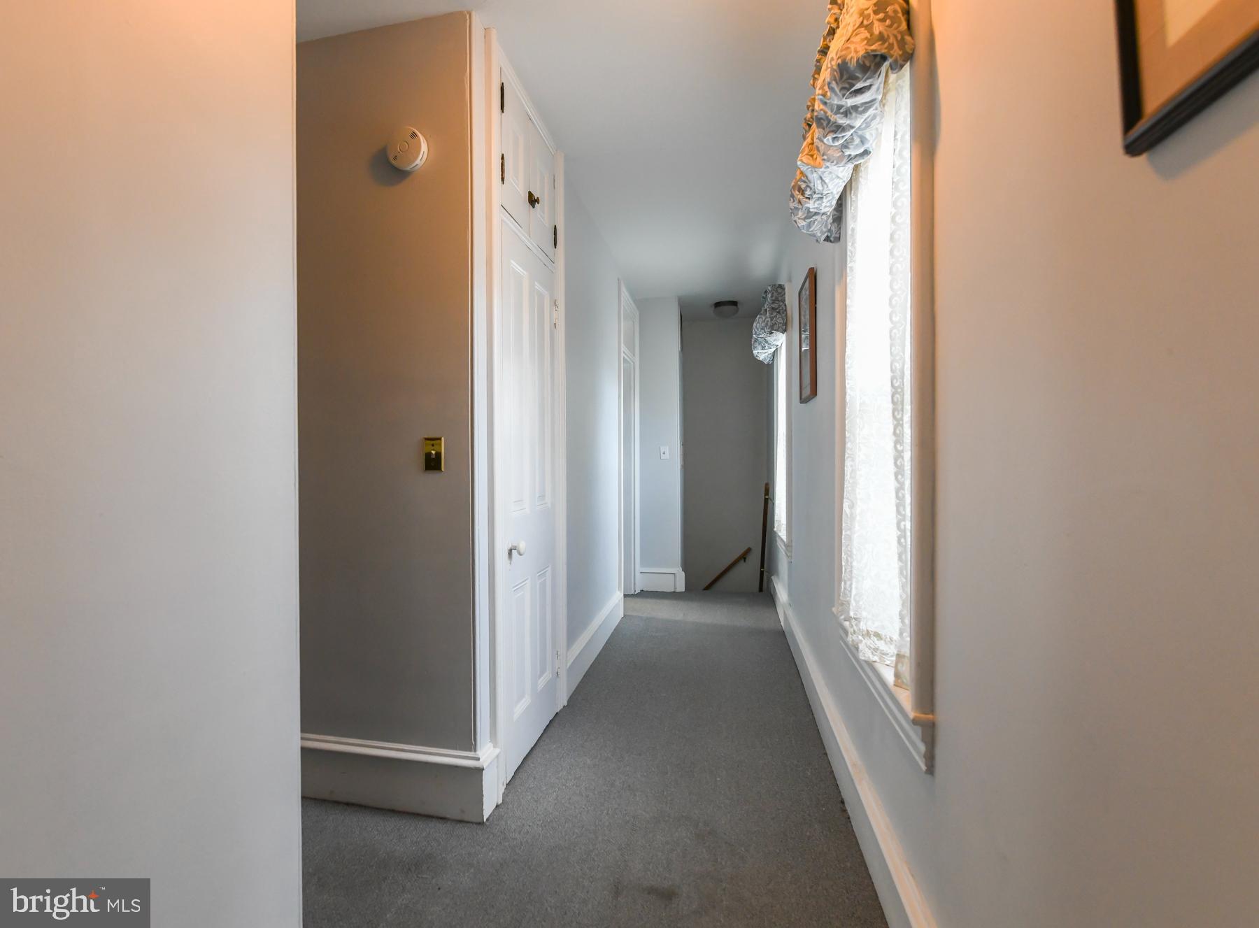 71 Cooper Street Woodbury, NJ 08096 - Photo 21 of 25 a view of a hallway with wooden floor