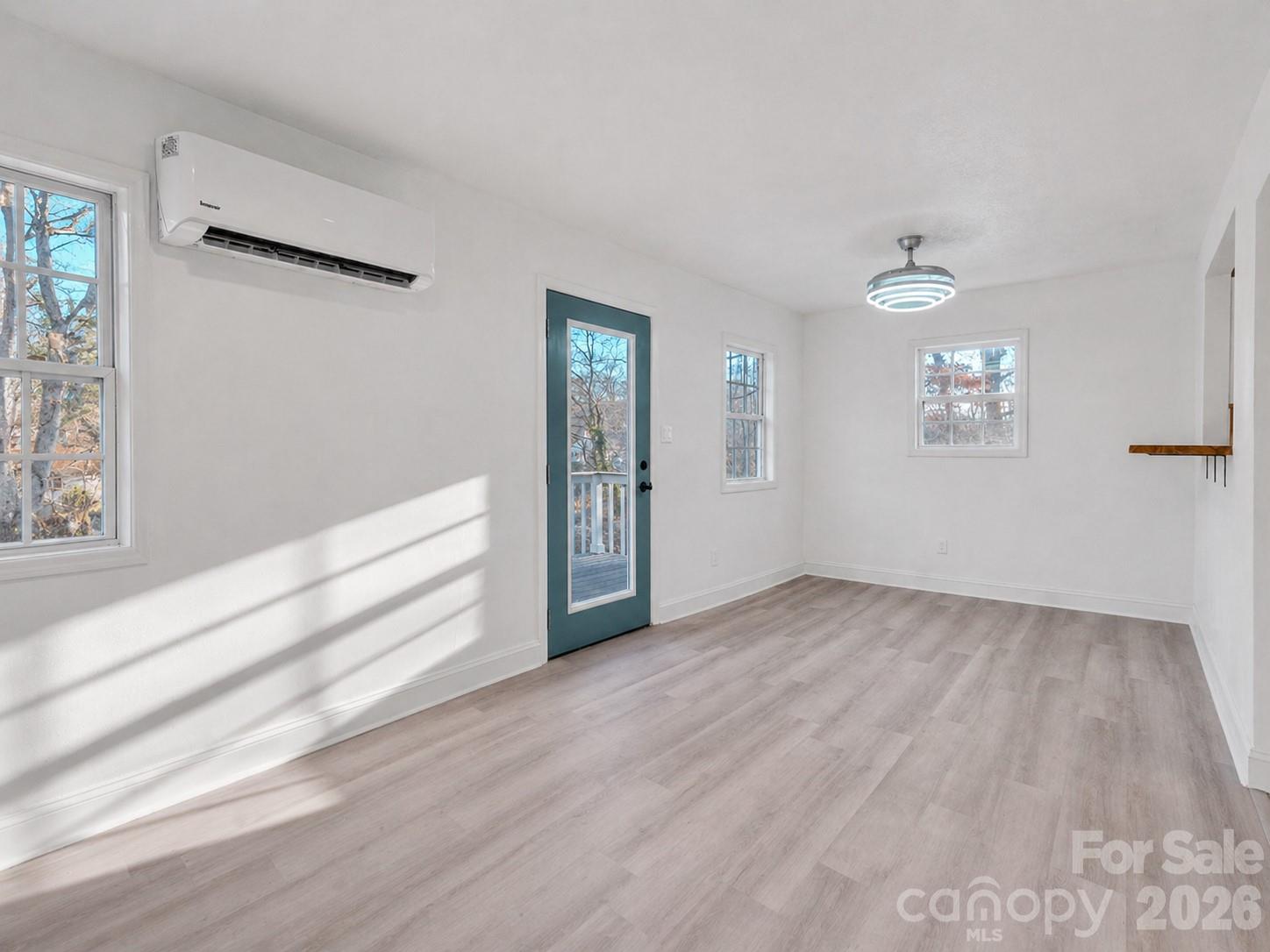 49 East Livingston Street Tryon, NC 28782 - Photo 8 of 27 wooden floor in an empty room with a window