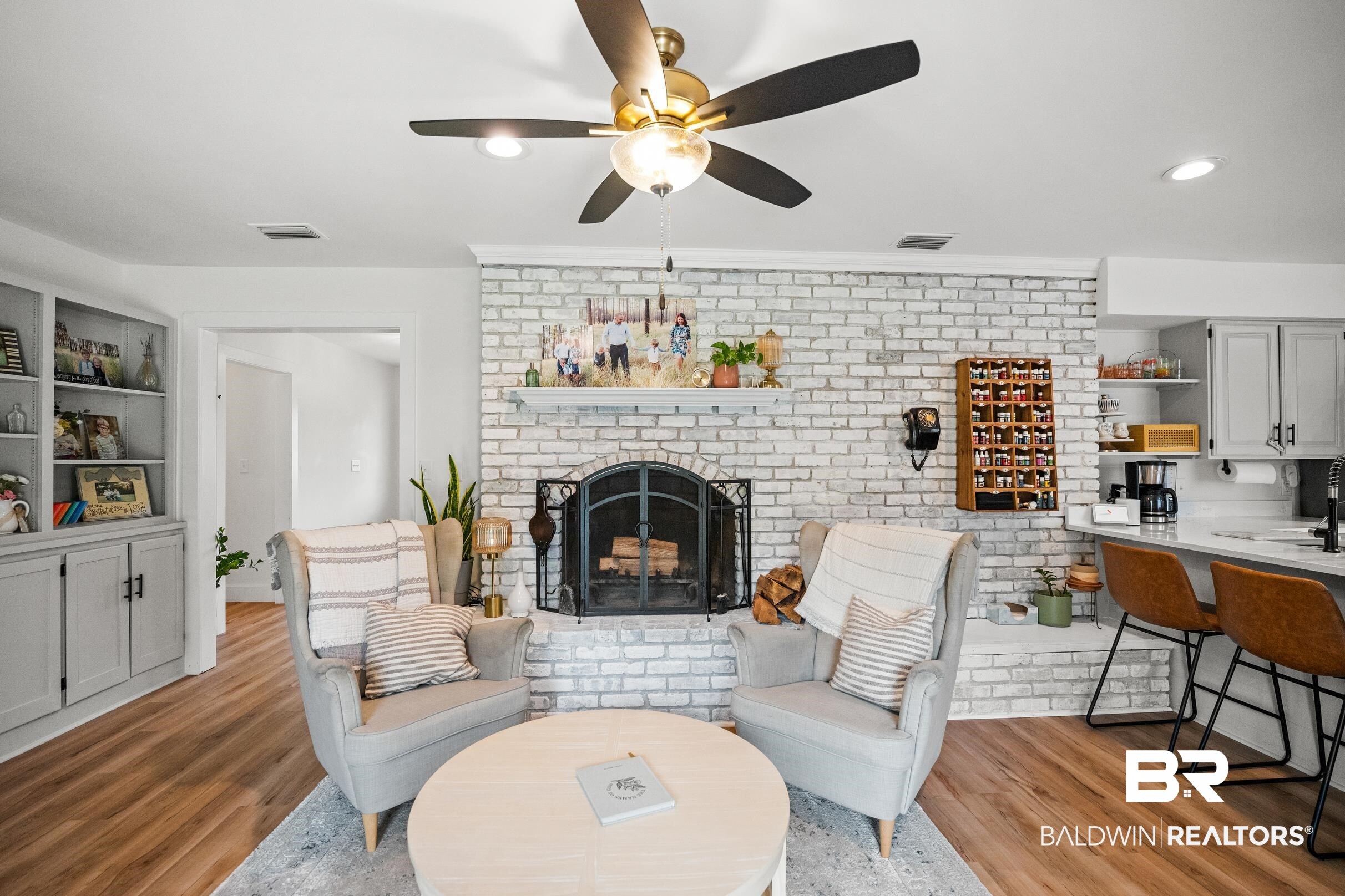 6 Wren Circle Foley, AL 36535 - Photo 34 of 55 Living room with light wood finished floors, visible vents, and a brick fireplace