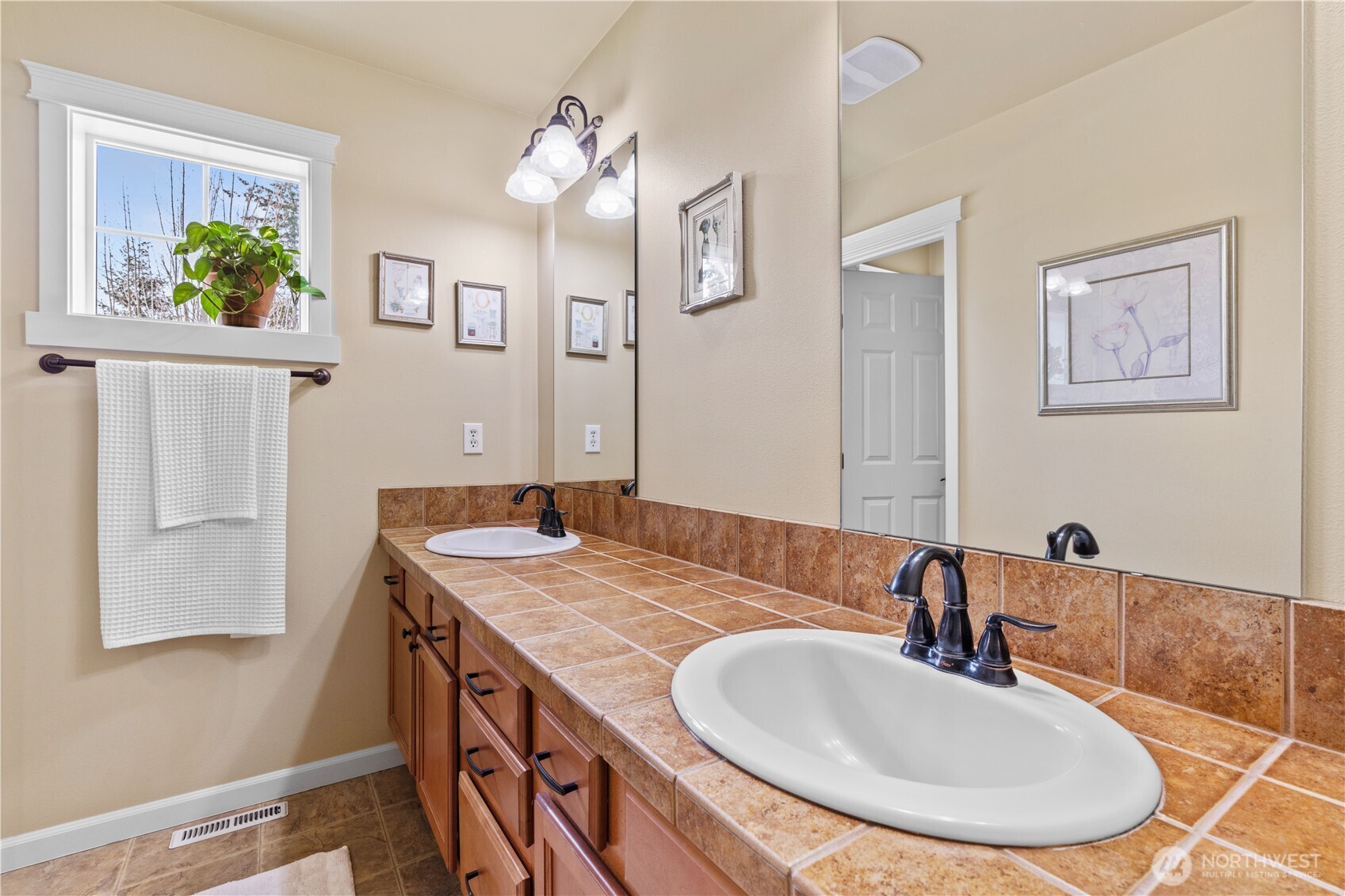 1375 Foreman Road DuPont, WA 98327 - Photo 15 of 30 a bathroom with a granite countertop sink a mirror and a