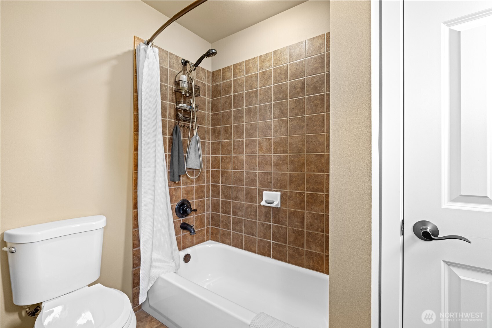 1375 Foreman Road DuPont, WA 98327 - Photo 16 of 30 a bathroom with a toilet and shower